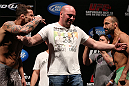 RIO DE JANEIRO, BRAZIL - OCTOBER 12:  Opponents Cristiano Marcello (L) and Reza Madadi (R) are separated by UFC President Dana White during the UFC 153 weigh in at HSBC Arena on October 12, 2012 in Rio de Janeiro, Brazil.  (Photo by Josh Hedges/Zuffa LLC/Zuffa LLC via Getty Images)