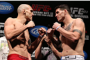 RIO DE JANEIRO, BRAZIL - OCTOBER 12:  (L-R) Opponents Luiz Cane and Chris Camozzi face off during the UFC 153 weigh in at HSBC Arena on October 12, 2012 in Rio de Janeiro, Brazil.  (Photo by Josh Hedges/Zuffa LLC/Zuffa LLC via Getty Images)