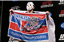 RIO DE JANEIRO, BRAZIL - OCTOBER 12:  Rony "Jason" Mariano Bezerra displays a flag on stage before weighing in during the UFC 153 weigh in at HSBC Arena on October 12, 2012 in Rio de Janeiro, Brazil.  (Photo by Josh Hedges/Zuffa LLC/Zuffa LLC via Getty Images)