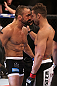 RIO DE JANEIRO, BRAZIL - OCTOBER 13:  (L-R) Reza Madadi and Cristiano Marcello stand nose-to-nose in the Octagon before their lightweight fight at UFC 153 inside HSBC Arena on October 13, 2012 in Rio de Janeiro, Brazil.  (Photo by Josh Hedges/Zuffa LLC/Zuffa LLC via Getty Images)