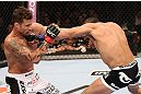 RIO DE JANEIRO, BRAZIL - OCTOBER 13:  (R-L) Reza Madadi punches Cristiano Marcello during their lightweight fight at UFC 153 inside HSBC Arena on October 13, 2012 in Rio de Janeiro, Brazil.  (Photo by Josh Hedges/Zuffa LLC/Zuffa LLC via Getty Images)