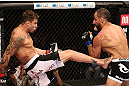 RIO DE JANEIRO, BRAZIL - OCTOBER 13:  (L-R) Cristiano Marcello kicks Reza Madadi during their lightweight fight at UFC 153 inside HSBC Arena on October 13, 2012 in Rio de Janeiro, Brazil.  (Photo by Josh Hedges/Zuffa LLC/Zuffa LLC via Getty Images)
