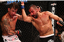 RIO DE JANEIRO, BRAZIL - OCTOBER 13:  (R-L) Reza Madadi punches Cristiano Marcello during their lightweight fight at UFC 153 inside HSBC Arena on October 13, 2012 in Rio de Janeiro, Brazil.  (Photo by Josh Hedges/Zuffa LLC/Zuffa LLC via Getty Images)