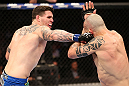 RIO DE JANEIRO, BRAZIL - OCTOBER 13:  (L-R) Chris Camozzi punches Luiz Cane during their middleweight fight at UFC 153 inside HSBC Arena on October 13, 2012 in Rio de Janeiro, Brazil.  (Photo by Josh Hedges/Zuffa LLC/Zuffa LLC via Getty Images)