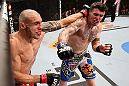 RIO DE JANEIRO, BRAZIL - OCTOBER 13:  (R-L) Chris Camozzi and Luiz Cane trade punches during their middleweight fight at UFC 153 inside HSBC Arena on October 13, 2012 in Rio de Janeiro, Brazil.  (Photo by Josh Hedges/Zuffa LLC/Zuffa LLC via Getty Images)