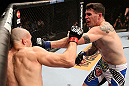 RIO DE JANEIRO, BRAZIL - OCTOBER 13:  (R-L) Chris Camozzi punches Luiz Cane during their middleweight fight at UFC 153 inside HSBC Arena on October 13, 2012 in Rio de Janeiro, Brazil.  (Photo by Josh Hedges/Zuffa LLC/Zuffa LLC via Getty Images)