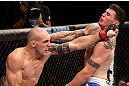 RIO DE JANEIRO, BRAZIL - OCTOBER 13:  (L-R) Luiz Cane punches Chris Camozzi during their middleweight fight at UFC 153 inside HSBC Arena on October 13, 2012 in Rio de Janeiro, Brazil.  (Photo by Josh Hedges/Zuffa LLC/Zuffa LLC via Getty Images)