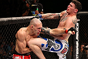 RIO DE JANEIRO, BRAZIL - OCTOBER 13:  (R-L) Chris Camozzi delivers a knee strike against Luiz Cane during their middleweight fight at UFC 153 inside HSBC Arena on October 13, 2012 in Rio de Janeiro, Brazil.  (Photo by Josh Hedges/Zuffa LLC/Zuffa LLC via Getty Images)