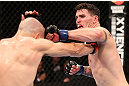 RIO DE JANEIRO, BRAZIL - OCTOBER 13:  (R-L) Chris Camozzi punches Luiz Cane during their middleweight fight at UFC 153 inside HSBC Arena on October 13, 2012 in Rio de Janeiro, Brazil.  (Photo by Josh Hedges/Zuffa LLC/Zuffa LLC via Getty Images)