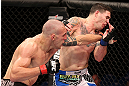 RIO DE JANEIRO, BRAZIL - OCTOBER 13:  (L-R) Luiz Cane punches Chris Camozzi during their middleweight fight at UFC 153 inside HSBC Arena on October 13, 2012 in Rio de Janeiro, Brazil.  (Photo by Josh Hedges/Zuffa LLC/Zuffa LLC via Getty Images)
