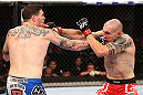 RIO DE JANEIRO, BRAZIL - OCTOBER 13:  (L-R) Chris Camozzi punches Luiz Cane during their middleweight fight at UFC 153 inside HSBC Arena on October 13, 2012 in Rio de Janeiro, Brazil.  (Photo by Josh Hedges/Zuffa LLC/Zuffa LLC via Getty Images)
