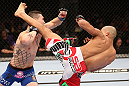 RIO DE JANEIRO, BRAZIL - OCTOBER 13:  (R-L) Diego Brandao kicks Joey Gambino during their featherweight fight at UFC 153 inside HSBC Arena on October 13, 2012 in Rio de Janeiro, Brazil.  (Photo by Josh Hedges/Zuffa LLC/Zuffa LLC via Getty Images)