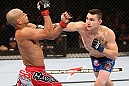 RIO DE JANEIRO, BRAZIL - OCTOBER 13:  (R-L) Joey Gambino punches Diego Brandao during their featherweight fight at UFC 153 inside HSBC Arena on October 13, 2012 in Rio de Janeiro, Brazil.  (Photo by Josh Hedges/Zuffa LLC/Zuffa LLC via Getty Images)