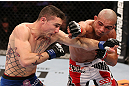 RIO DE JANEIRO, BRAZIL - OCTOBER 13:  (R-L) Diego Brandao punches Joey Gambino during their featherweight fight at UFC 153 inside HSBC Arena on October 13, 2012 in Rio de Janeiro, Brazil.  (Photo by Josh Hedges/Zuffa LLC/Zuffa LLC via Getty Images)