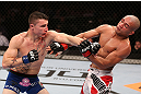 RIO DE JANEIRO, BRAZIL - OCTOBER 13:  (L-R) Joey Gambino punches Diego Brandao during their featherweight fight at UFC 153 inside HSBC Arena on October 13, 2012 in Rio de Janeiro, Brazil.  (Photo by Josh Hedges/Zuffa LLC/Zuffa LLC via Getty Images)