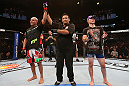 RIO DE JANEIRO, BRAZIL - OCTOBER 13:  Diego Brandao (L) reacts after defeating Joey Gambino during their featherweight fight at UFC 153 inside HSBC Arena on October 13, 2012 in Rio de Janeiro, Brazil.  (Photo by Josh Hedges/Zuffa LLC/Zuffa LLC via Getty Images)