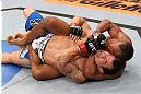 RIO DE JANEIRO, BRAZIL - OCTOBER 13:  (R-L) Francisco Trinaldo attempts a choke submission against Gleison Tibau during their lightweight fight at UFC 153 inside HSBC Arena on October 13, 2012 in Rio de Janeiro, Brazil.  (Photo by Josh Hedges/Zuffa LLC/Zuffa LLC via Getty Images)