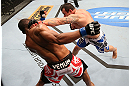 RIO DE JANEIRO, BRAZIL - OCTOBER 13:  (R-L) Gleison Tibau punches Francisco Trinaldo during their lightweight fight at UFC 153 inside HSBC Arena on October 13, 2012 in Rio de Janeiro, Brazil.  (Photo by Josh Hedges/Zuffa LLC/Zuffa LLC via Getty Images)