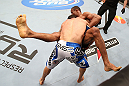 RIO DE JANEIRO, BRAZIL - OCTOBER 13:  (L-R) Gleison Tibau takes down Francisco Trinaldo during their lightweight fight at UFC 153 inside HSBC Arena on October 13, 2012 in Rio de Janeiro, Brazil.  (Photo by Josh Hedges/Zuffa LLC/Zuffa LLC via Getty Images)