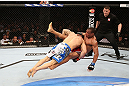 RIO DE JANEIRO, BRAZIL - OCTOBER 13:  (L-R) Gleison Tibau takes down Francisco Trinaldo during their lightweight fight at UFC 153 inside HSBC Arena on October 13, 2012 in Rio de Janeiro, Brazil.  (Photo by Josh Hedges/Zuffa LLC/Zuffa LLC via Getty Images)