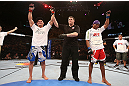 RIO DE JANEIRO, BRAZIL - OCTOBER 13:  Gleison Tibau (L) reacts after defeating Francisco Trinaldo during their lightweight fight at UFC 153 inside HSBC Arena on October 13, 2012 in Rio de Janeiro, Brazil.  (Photo by Josh Hedges/Zuffa LLC/Zuffa LLC via Getty Images)