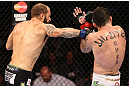 RIO DE JANEIRO, BRAZIL - OCTOBER 13:  (L-R) Sam Sicilia punches Rony "Jason" Mariano Bezerra during their featherweight fight at UFC 153 inside HSBC Arena on October 13, 2012 in Rio de Janeiro, Brazil.  (Photo by Josh Hedges/Zuffa LLC/Zuffa LLC via Getty Images)