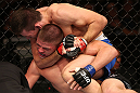 RIO DE JANEIRO, BRAZIL - OCTOBER 13:  (R-L) Demian Maia secures a rear choke submission against Rick Story during their welterweight fight at UFC 153 inside HSBC Arena on October 13, 2012 in Rio de Janeiro, Brazil.  (Photo by Josh Hedges/Zuffa LLC/Zuffa LLC via Getty Images)