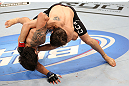 RIO DE JANEIRO, BRAZIL - OCTOBER 13:  (R-L) Jon Fitch takes down Erick Silva during their welterweight fight at UFC 153 inside HSBC Arena on October 13, 2012 in Rio de Janeiro, Brazil.  (Photo by Josh Hedges/Zuffa LLC/Zuffa LLC via Getty Images)