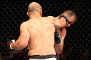 RIO DE JANEIRO, BRAZIL - OCTOBER 13:  (L-R) Glover Teixeira punches Fabio Maldonado during their light heavyweight fight at UFC 153 inside HSBC Arena on October 13, 2012 in Rio de Janeiro, Brazil.  (Photo by Josh Hedges/Zuffa LLC/Zuffa LLC via Getty Images)