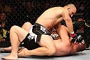 RIO DE JANEIRO, BRAZIL - OCTOBER 13:  (L-R) Glover Teixeira punches Fabio Maldonado during their light heavyweight fight at UFC 153 inside HSBC Arena on October 13, 2012 in Rio de Janeiro, Brazil.  (Photo by Josh Hedges/Zuffa LLC/Zuffa LLC via Getty Images)