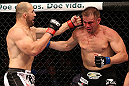 RIO DE JANEIRO, BRAZIL - OCTOBER 13:  (L-R) Glover Teixeira punches Fabio Maldonado during their light heavyweight fight at UFC 153 inside HSBC Arena on October 13, 2012 in Rio de Janeiro, Brazil.  (Photo by Josh Hedges/Zuffa LLC/Zuffa LLC via Getty Images)