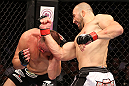 RIO DE JANEIRO, BRAZIL - OCTOBER 13:  (R-L) Glover Teixeira punches Fabio Maldonado during their light heavyweight fight at UFC 153 inside HSBC Arena on October 13, 2012 in Rio de Janeiro, Brazil.  (Photo by Josh Hedges/Zuffa LLC/Zuffa LLC via Getty Images)