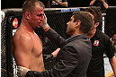 RIO DE JANEIRO, BRAZIL - OCTOBER 13:  A doctor examines Fabio Maldonado (L) during his light heavyweight fight against Glover Teixeira at UFC 153 inside HSBC Arena on October 13, 2012 in Rio de Janeiro, Brazil.  (Photo by Josh Hedges/Zuffa LLC/Zuffa LLC via Getty Images)