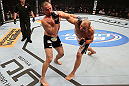 RIO DE JANEIRO, BRAZIL - OCTOBER 13:  (R-L) Glover Teixeira punches Fabio Maldonado during their light heavyweight fight at UFC 153 inside HSBC Arena on October 13, 2012 in Rio de Janeiro, Brazil.  (Photo by Josh Hedges/Zuffa LLC/Zuffa LLC via Getty Images)