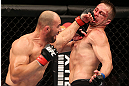 RIO DE JANEIRO, BRAZIL - OCTOBER 13:  (L-R) Glover Teixeira punches Fabio Maldonado during their light heavyweight fight at UFC 153 inside HSBC Arena on October 13, 2012 in Rio de Janeiro, Brazil.  (Photo by Josh Hedges/Zuffa LLC/Zuffa LLC via Getty Images)
