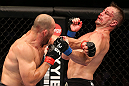 RIO DE JANEIRO, BRAZIL - OCTOBER 13:  (L-R) Glover Teixeira punches Fabio Maldonado during their light heavyweight fight at UFC 153 inside HSBC Arena on October 13, 2012 in Rio de Janeiro, Brazil.  (Photo by Josh Hedges/Zuffa LLC/Zuffa LLC via Getty Images)