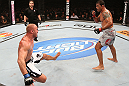 RIO DE JANEIRO, BRAZIL - OCTOBER 13:  (R-L) Antonio Rodrigo "Minotauro" Nogeuira knocks down Dave Herman with a punch during their heavyweight fight at UFC 153 inside HSBC Arena on October 13, 2012 in Rio de Janeiro, Brazil.  (Photo by Josh Hedges/Zuffa LLC/Zuffa LLC via Getty Images)