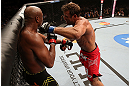 RIO DE JANEIRO, BRAZIL - OCTOBER 13:  (R-L) Stephan Bonnar punches Anderson Silva during their light heavyweight fight at UFC 153 inside HSBC Arena on October 13, 2012 in Rio de Janeiro, Brazil.  (Photo by Josh Hedges/Zuffa LLC/Zuffa LLC via Getty Images)