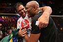 RIO DE JANEIRO, BRAZIL - OCTOBER 13:  (R-L) Anderson Silva and his teammate Antonio Rodrigo "Minotauro" Nogeuira celebrate after Silva's victory over Stephan Bonnar during their light heavyweight fight at UFC 153 inside HSBC Arena on October 13, 2012 in Rio de Janeiro, Brazil.  (Photo by Josh Hedges/Zuffa LLC/Zuffa LLC via Getty Images)