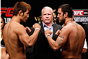 MACAU, MACAU - NOVEMBER 09:  (L-R) Opponents Riki Fukuda and Tom DeBlass face off during the UFC Macau weigh in at Cotai Arena on November 9, 2012 in Macau, Macau.  (Photo by Josh Hedges/Zuffa LLC/Zuffa LLC via Getty Images)