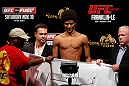 MACAU, MACAU - NOVEMBER 09:  Alex Caceres makes weight during the UFC Macau weigh in at Cotai Arena on November 9, 2012 in Macau, Macau.  (Photo by Josh Hedges/Zuffa LLC/Zuffa LLC via Getty Images)