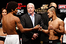 MACAU, MACAU - NOVEMBER 09:  (L-R) Opponents Alex Caceres and Motonobu Tezuka face off during the UFC Macau weigh in at Cotai Arena on November 9, 2012 in Macau, Macau.  (Photo by Josh Hedges/Zuffa LLC/Zuffa LLC via Getty Images)