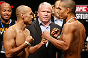 MACAU, MACAU - NOVEMBER 09:  (L-R) Opponents Tiequan Zhang and Jon Tuck face off during the UFC Macau weigh in at Cotai Arena on November 9, 2012 in Macau, Macau.  (Photo by Josh Hedges/Zuffa LLC/Zuffa LLC via Getty Images)