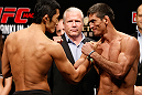 MACAU, MACAU - NOVEMBER 09:  (L-R) Opponents Dong Hyun Kim and Paulo Thiago face off during the UFC Macau weigh in at Cotai Arena on November 9, 2012 in Macau, Macau.  (Photo by Josh Hedges/Zuffa LLC/Zuffa LLC via Getty Images)