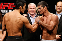 MACAU, MACAU - NOVEMBER 09:  (L-R) Opponents Dong Hyun Kim and Paulo Thiago face off during the UFC Macau weigh in at Cotai Arena on November 9, 2012 in Macau, Macau.  (Photo by Josh Hedges/Zuffa LLC/Zuffa LLC via Getty Images)