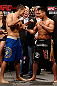 MACAU, MACAU - NOVEMBER 09:  (L-R) Opponents Rich Franklin and Cung Le face off during the UFC Macau weigh in at Cotai Arena on November 9, 2012 in Macau, Macau.  (Photo by Josh Hedges/Zuffa LLC/Zuffa LLC via Getty Images)