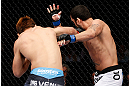 MACAU, MACAU - NOVEMBER 10: (L-R) Riki Fukuda punches Tom DeBlass during their middleweight bout at the UFC Macao event inside CotaiArena on November 10, 2012 in Macau, Macau. (Photo by Josh Hedges/Zuffa LLC/Zuffa LLC via Getty Images)