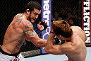 MACAU, MACAU - NOVEMBER 10: (L-R) Tom DeBlass punches Riki Fukuda during their middleweight bout at the UFC Macao event inside CotaiArena on November 10, 2012 in Macau, Macau. (Photo by Josh Hedges/Zuffa LLC/Zuffa LLC via Getty Images)