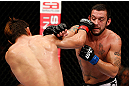 MACAU, MACAU - NOVEMBER 10: (L-R) Riki Fukuda and Tom DeBlass trade punches during their middleweight bout at the UFC Macao event inside CotaiArena on November 10, 2012 in Macau, Macau. (Photo by Josh Hedges/Zuffa LLC/Zuffa LLC via Getty Images)
