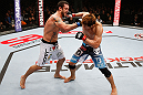 MACAU, MACAU - NOVEMBER 10:  (L-R) Tom DeBlass punches Riki Fukuda during their middleweight bout at the UFC Macao event inside CotaiArena on November 10, 2012 in Macau, Macau.  (Photo by Josh Hedges/Zuffa LLC/Zuffa LLC via Getty Images)